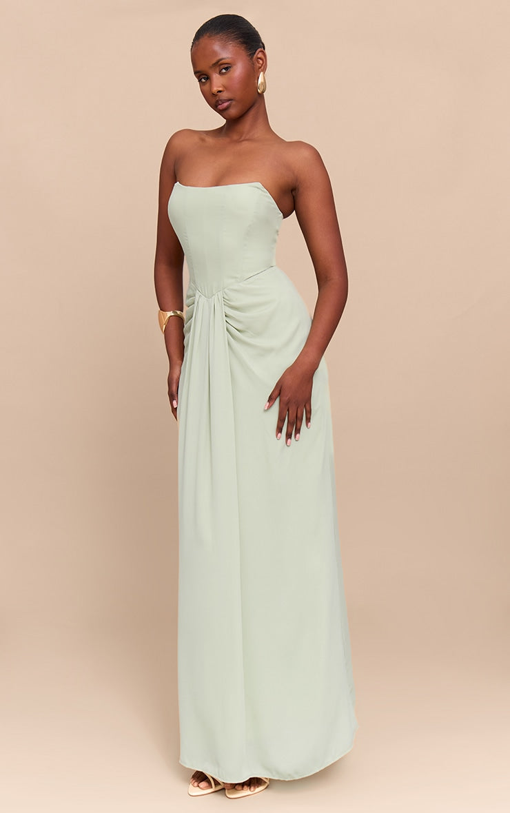 https://cdn-img.prettylittlething.com/1/1/0/5/1105527c5f4f52779e096a7def666be19655dd03_CNM5831_3_sage_green_bandeau_corset_drape_detail_maxi_dress.jpg