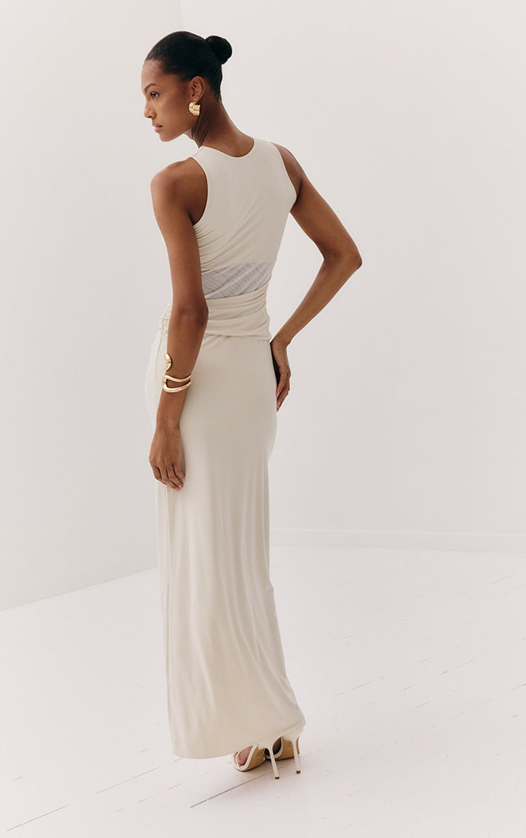https://cdn-img.prettylittlething.com/1/5/5/9/1559fcc9a776b724c07ae64b26bb6e11d43c181f_CNM7259_2_almond_slinky_mesh_cut_out_maxi_dress.jpg