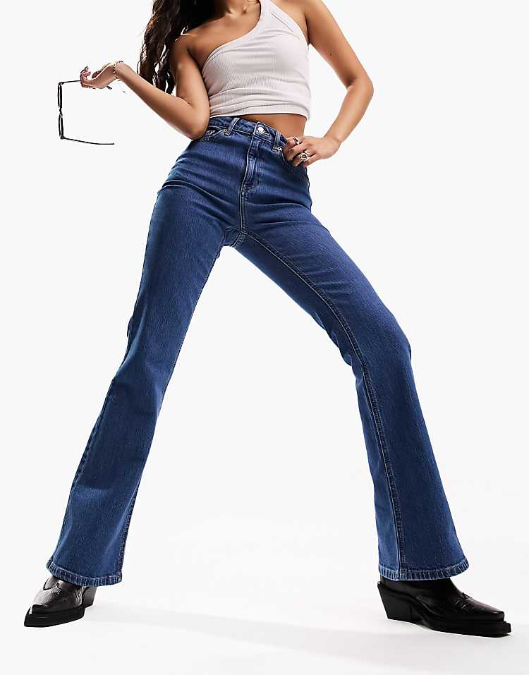 https://images.asos-media.com/products/asos-design-mid-rise-flare-jeans-in-mid-blue/204265302-5?$n_750w$&wid=750&fit=constrain