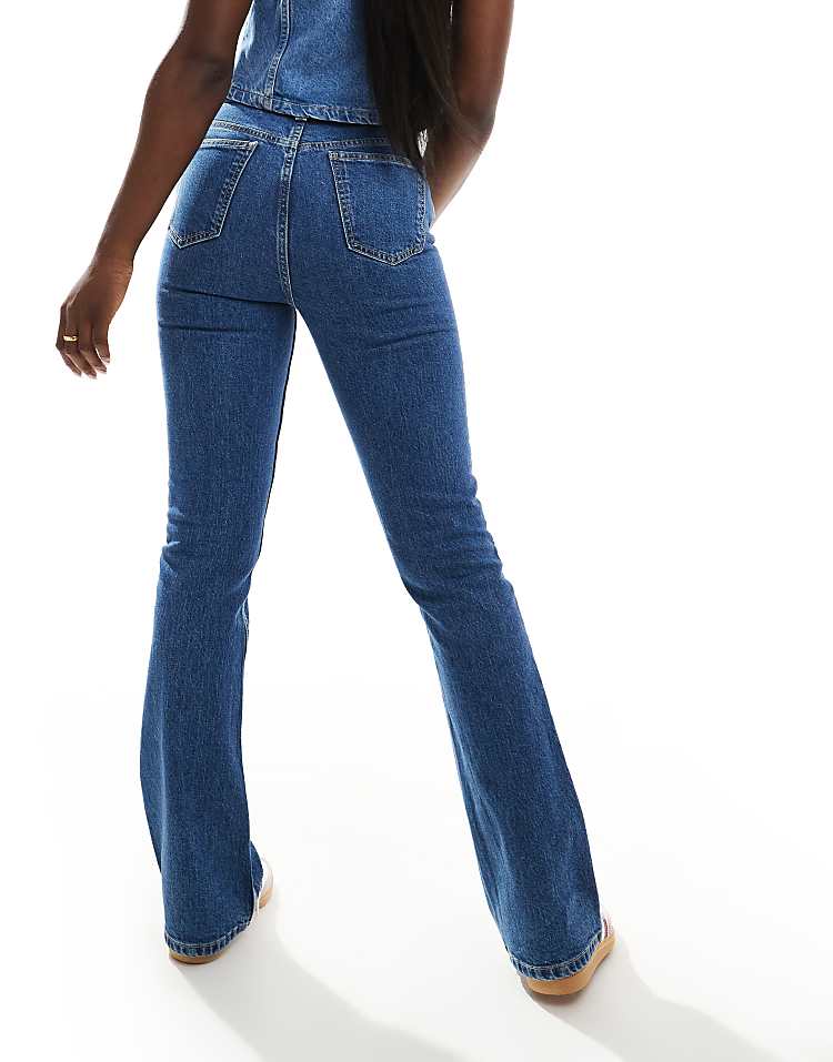 https://images.asos-media.com/products/asos-design-mid-rise-flare-jeans-in-mid-blue/206427970-3?$n_750w$&wid=750&fit=constrain