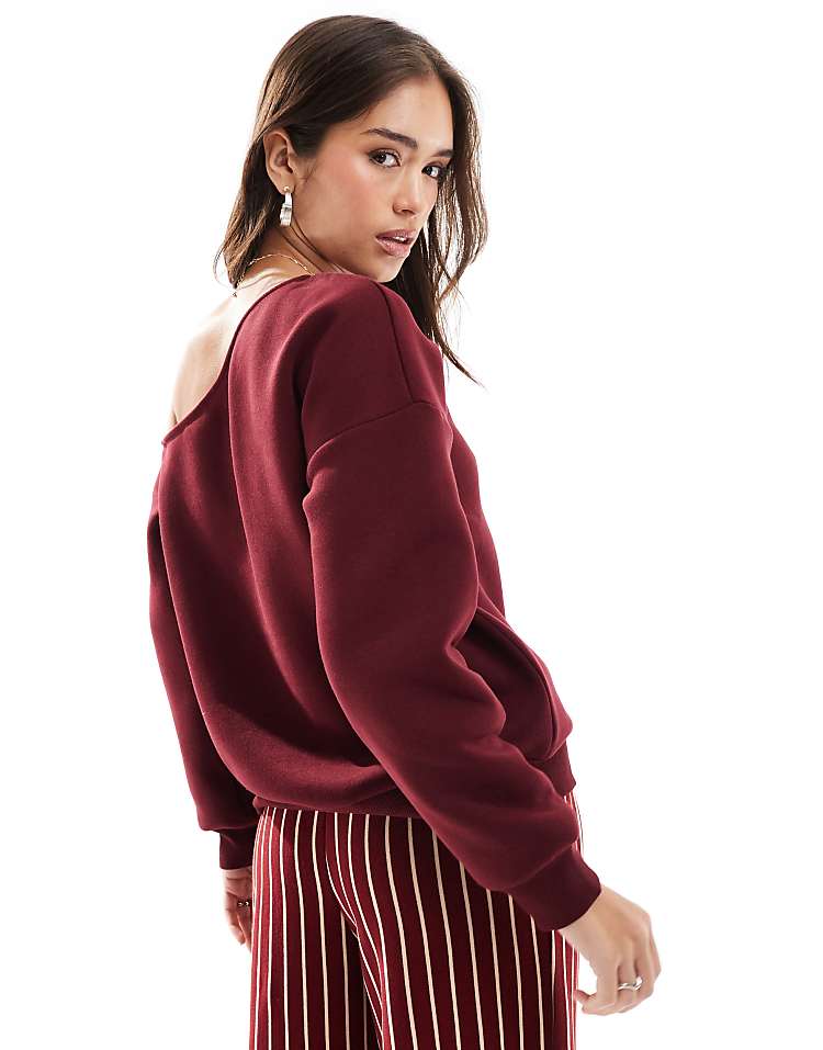 ASOS DESIGN asymmetric slouchy sweatshirt in burgundy