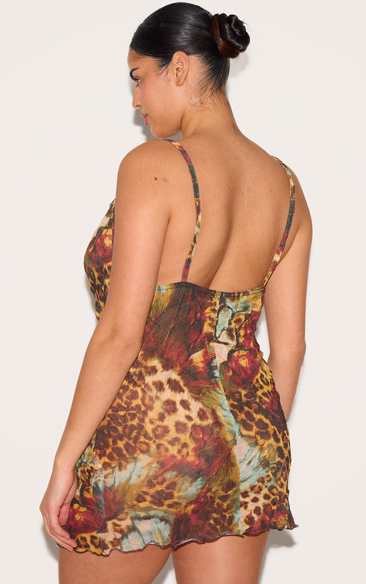 https://cdn-img.prettylittlething.com/5/1/a/a/51aa4665a77b38d391d8fb6135c1ccf614964073_CNK2378_2_plus_leopard_abstract_crinkle_mesh_cowl_neck_mini_dress.jpg