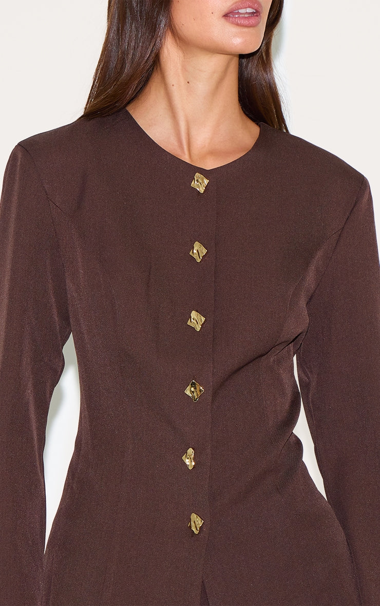 https://cdn-img.prettylittlething.com/6/2/c/6/62c60bdf6009eb765aed541a48958446c1198279_CNM0404_4_deep_chocolate_gold_trim_cinched_waist_shirt.jpg