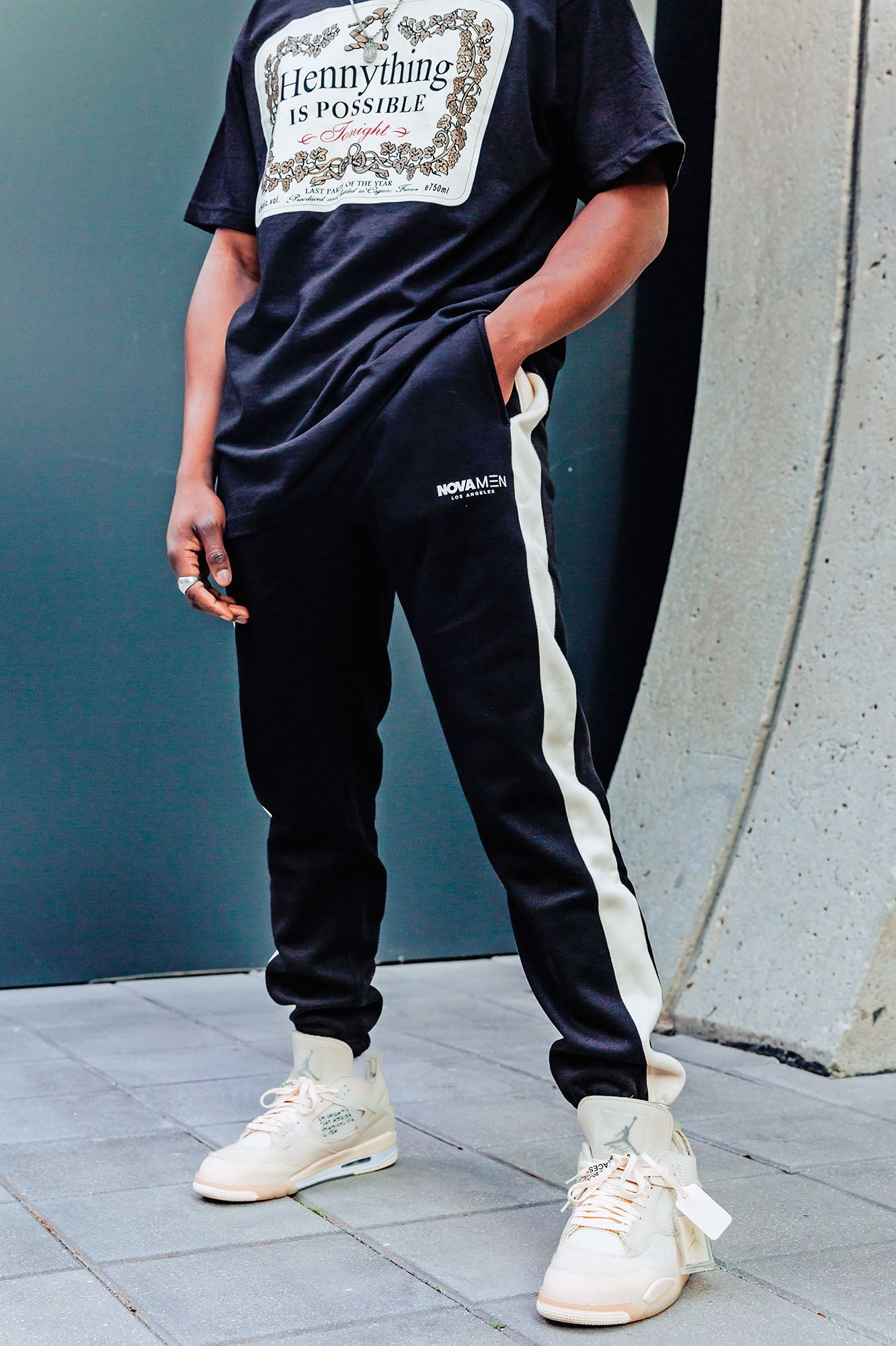 https://cdn.shopify.com/s/files/1/0293/9277/products/HennythingIsPossibleShortSleeveCrewTee-Black_MER.jpg?v=1649978388