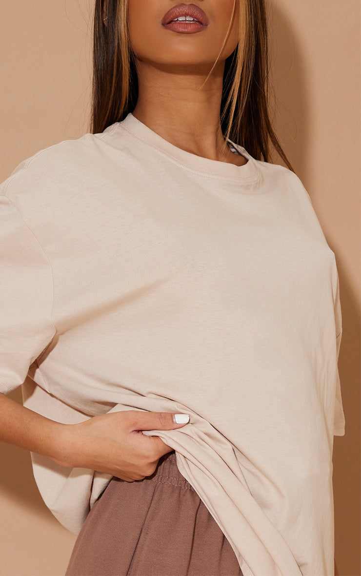 https://cdn-img.prettylittlething.com/8/7/0/9/87095ae6100b80f30306c72da5618a2fed2286a1_CMS8140_4_cotton_sand_oversized_t_shirt.jpg