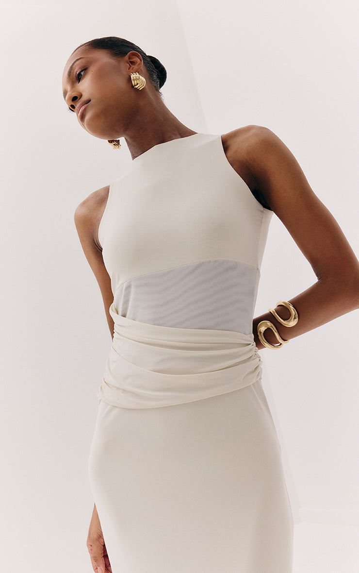 https://cdn-img.prettylittlething.com/c/f/2/7/cf277e85e6799bc8a45b982f974c1bc3f2517b02_CNM7259_4_almond_slinky_mesh_cut_out_maxi_dress.jpg